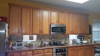 Before and After Cabinet Refinishing and Painting of Walls in Atascocita area 